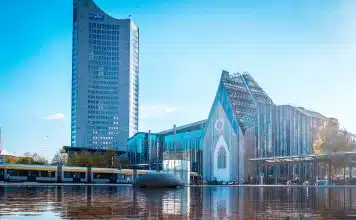 blue and white concrete building near body of water during daytime